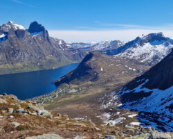 Fjordgård is framed by magnificent mountains